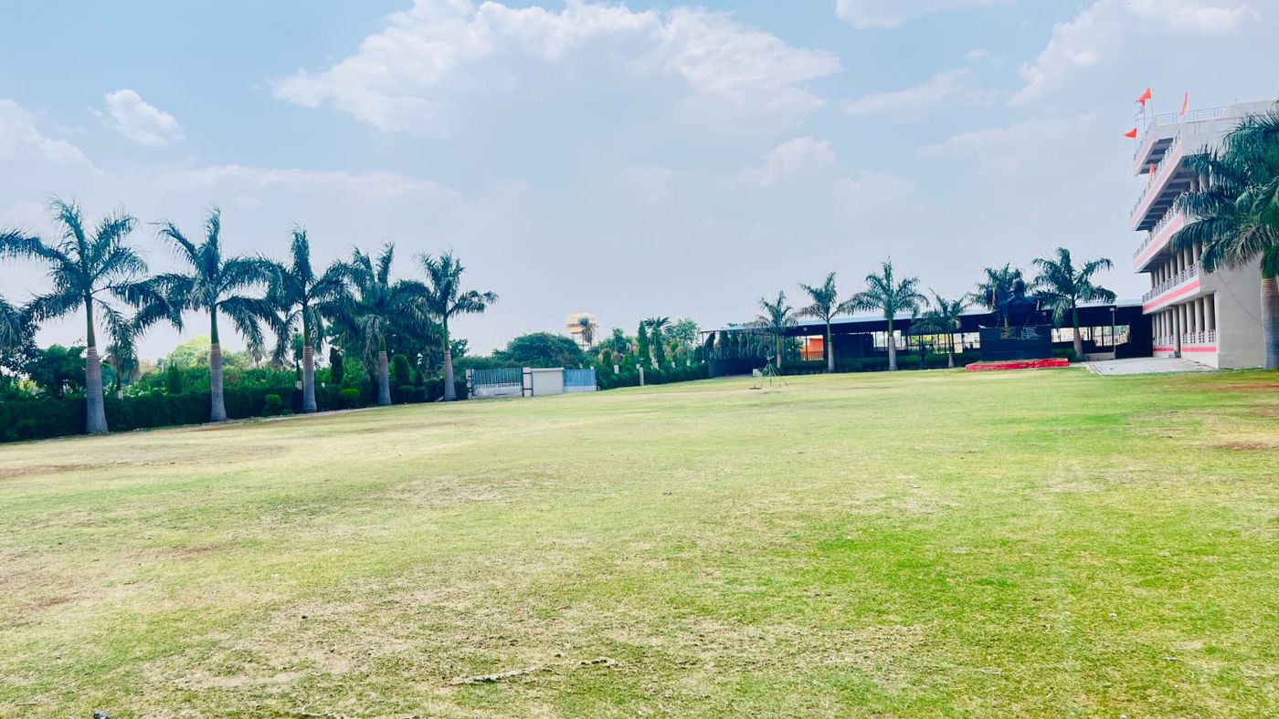 Palm-lined grounds — landscaping by Choudhary Garden Services